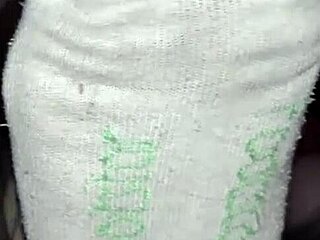 Master worships slave's feet in nylon socks during gay bdsm session.