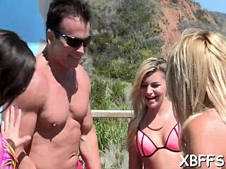 Young adults pleasure a large penis together