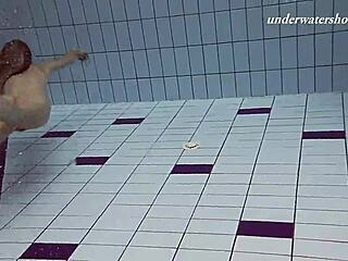 iva brizgina and paulinka dive into softcore lesbian fun in the pool with bikini-clad blonde and brunette.