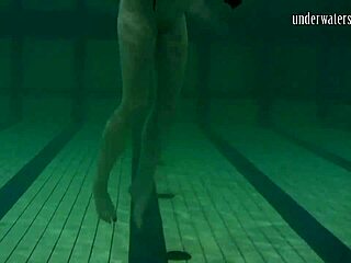 Brunette teen Kristina Andreeva swims naked in the pool underwater