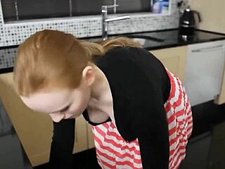Redhead’s Saggy Boobs Caught on Voyeur in Kitchen