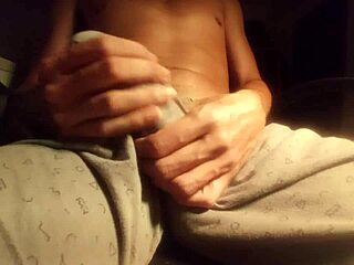 hot guy moaning and jerking off his big cock in pajamas