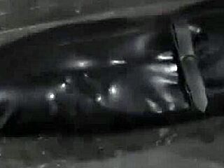 Petite Woman Strips Inside Steel Cage For Femdom Blowjob