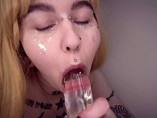 this cute slut gives a sloppy blowjob to a clear dildo