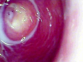 Camera plunges deep into wet pussy, capturing intense orgasm?