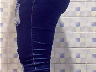 Madura caught in public bathroom, bending over with big ass and natural tits in chubby latina action.