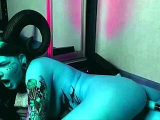 Whoa, that tattooed blue slut with huge tits is getting pounded by a machine in cosplay!