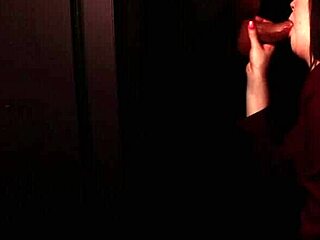 in the dim gloryhole booth a blue-eyed student in lingerie deepthroats cock swallows cum and gets facial from neighbor